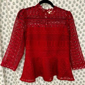 Beautiful red peplum top in great condition. Extremely unique and flattering